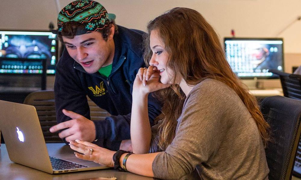 Students work together on a media art project